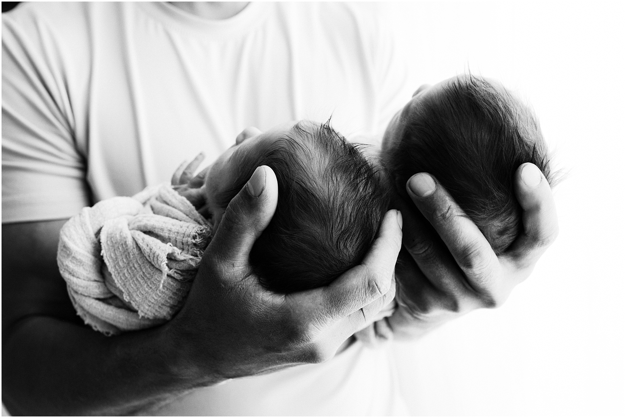 Dad holding twins