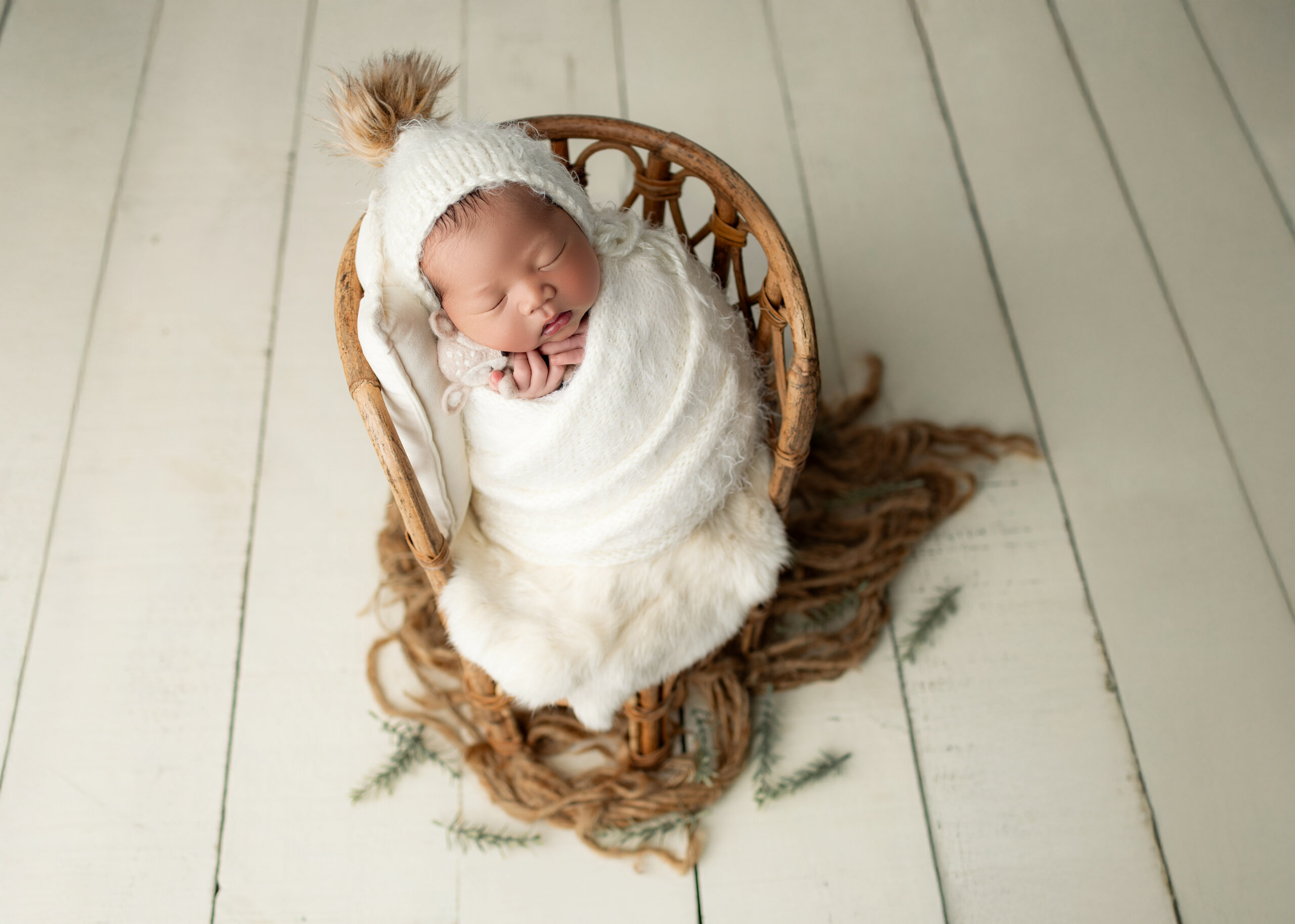 baby boy in potato wrap on chair